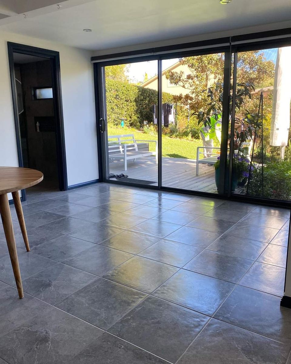 Clean tiled floor and sliding doors after a move-out clean